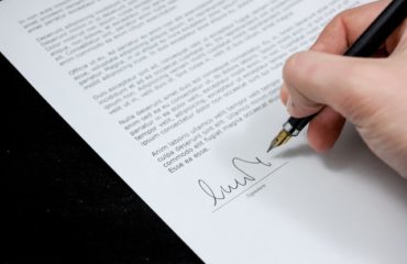 Notary Public Lawyer Signing Papers | Bernard Lau and Co.